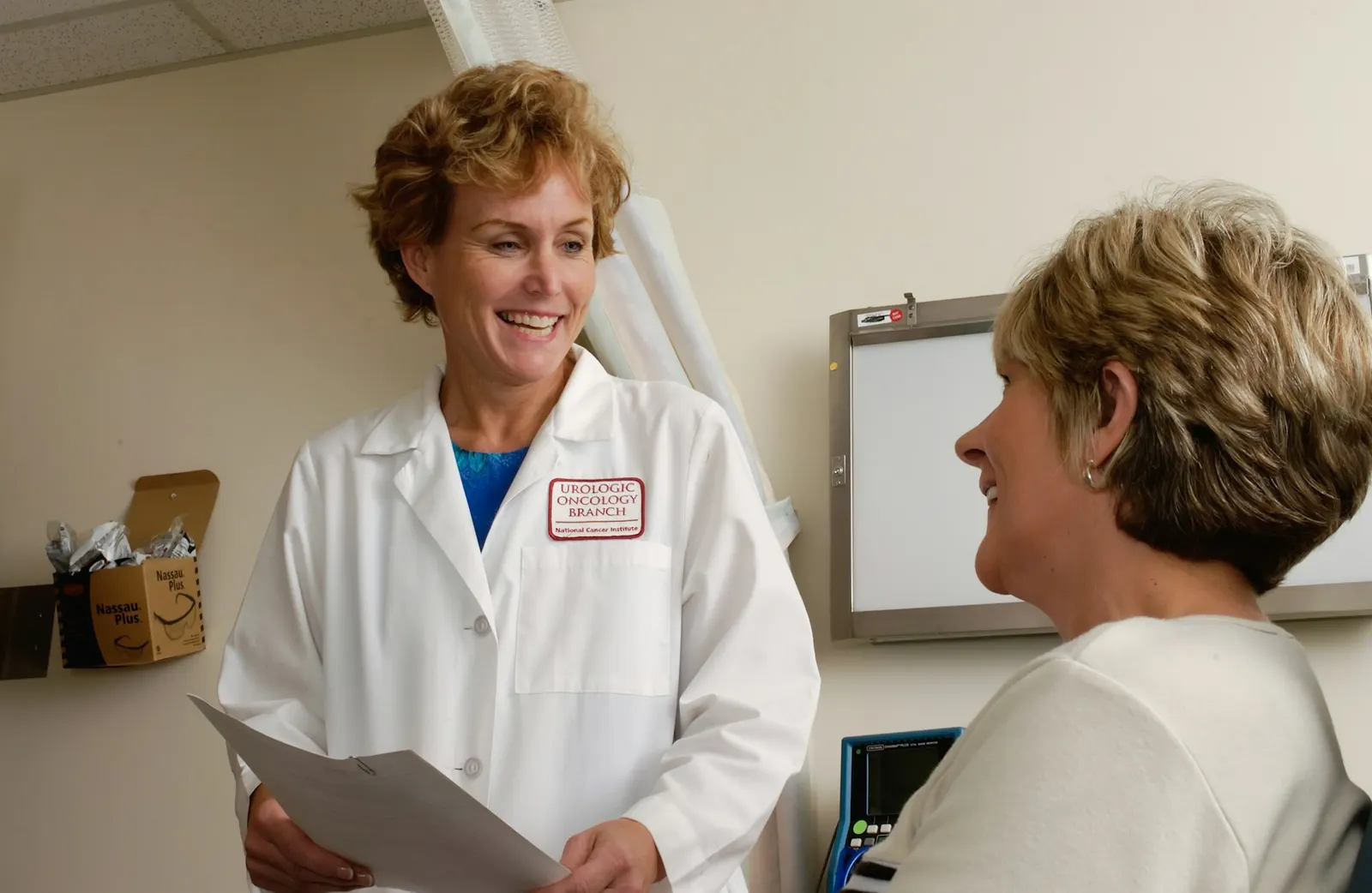 A physician reviewing results with a patient in a bright clinic