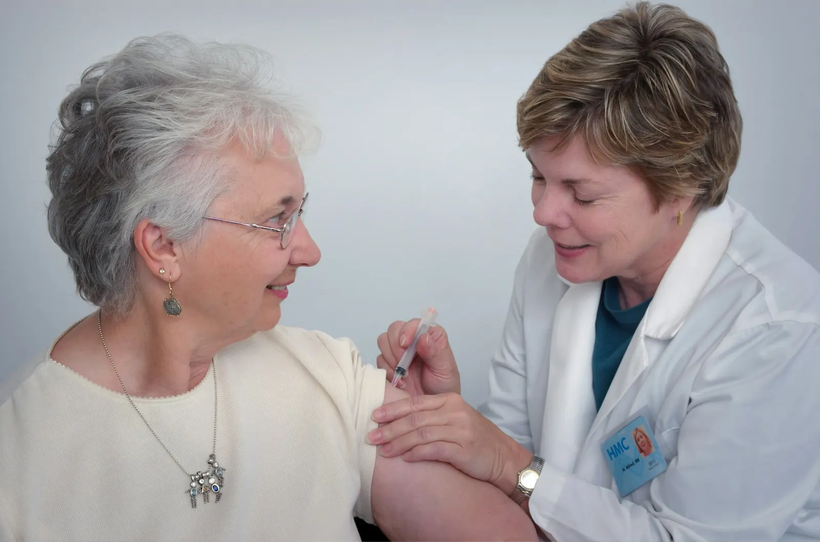 A clinician talking with an older patient